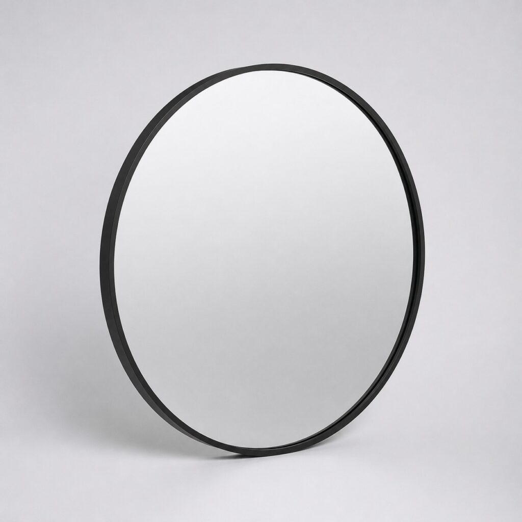 Miroir rond de salle de bain à cadre noir mat sur fond gris clair