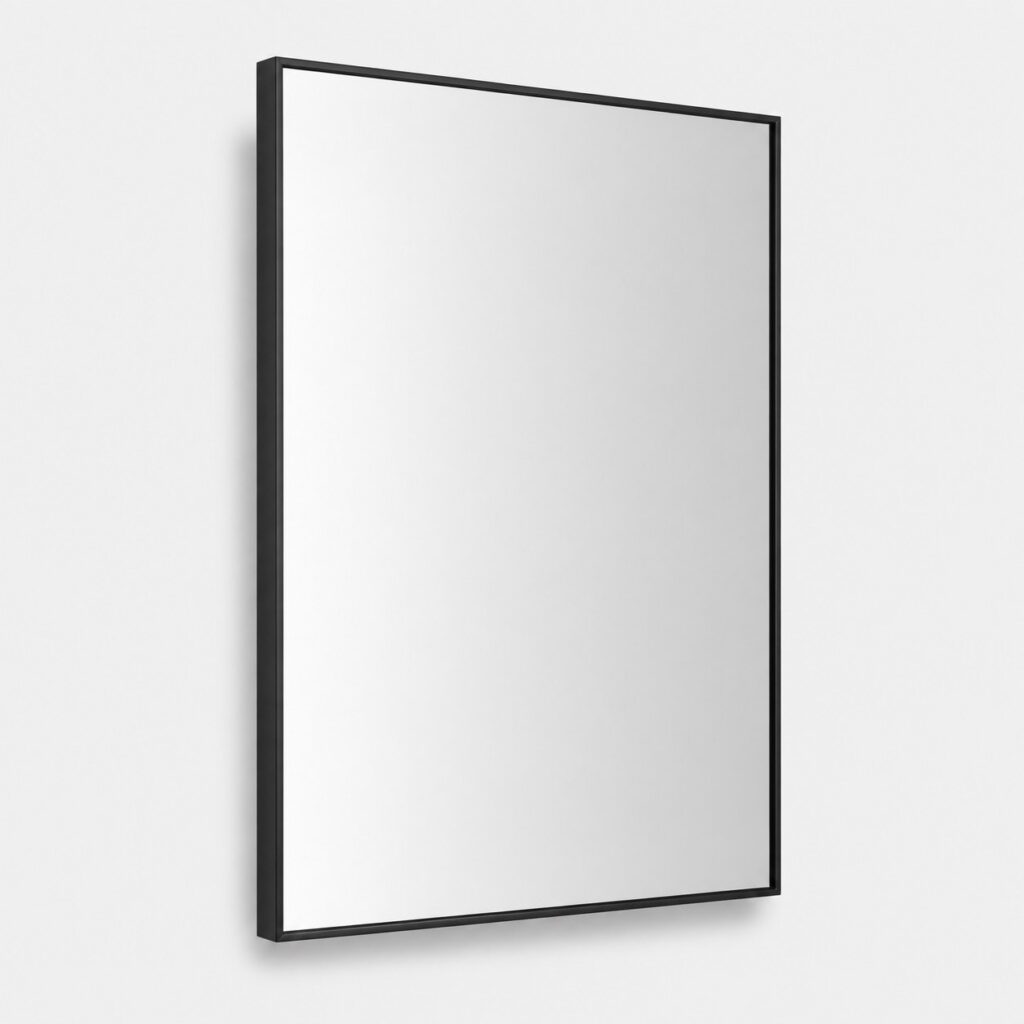 Miroir mural décoratif rectangulaire à cadre noir mat sur fond gris clair